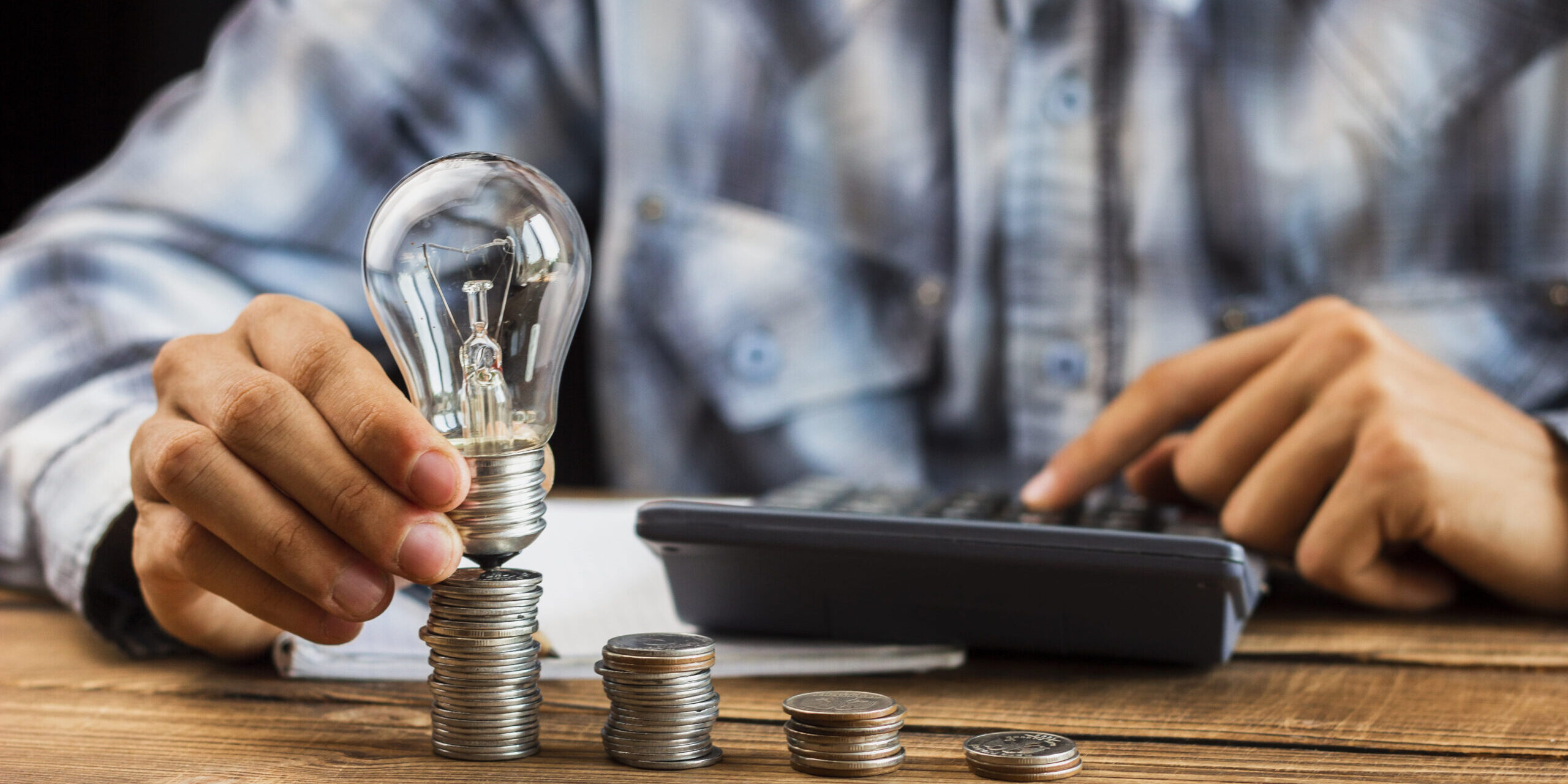 man-cunting-the-stack-of-coins (1)