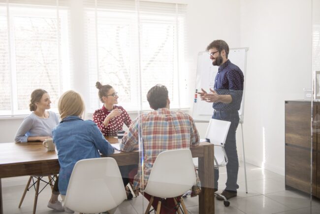 executive-presenting-strategy-of-work-min