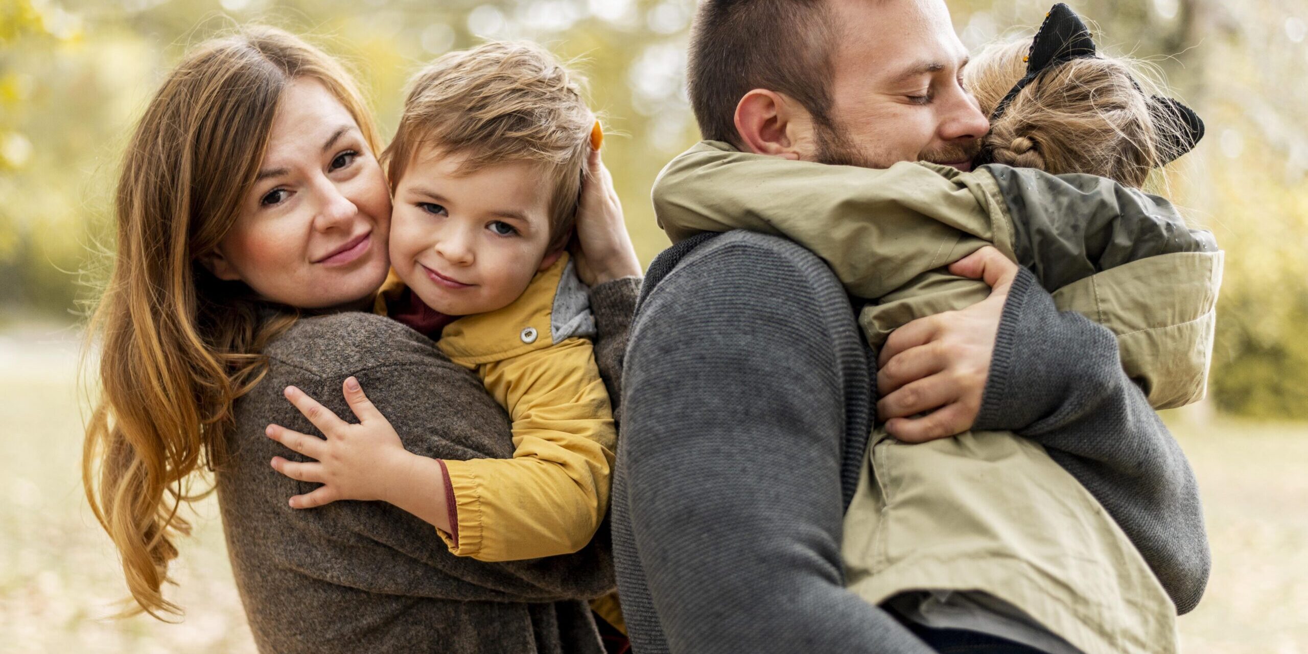 medium-shot-happy-parents-hugging-kids