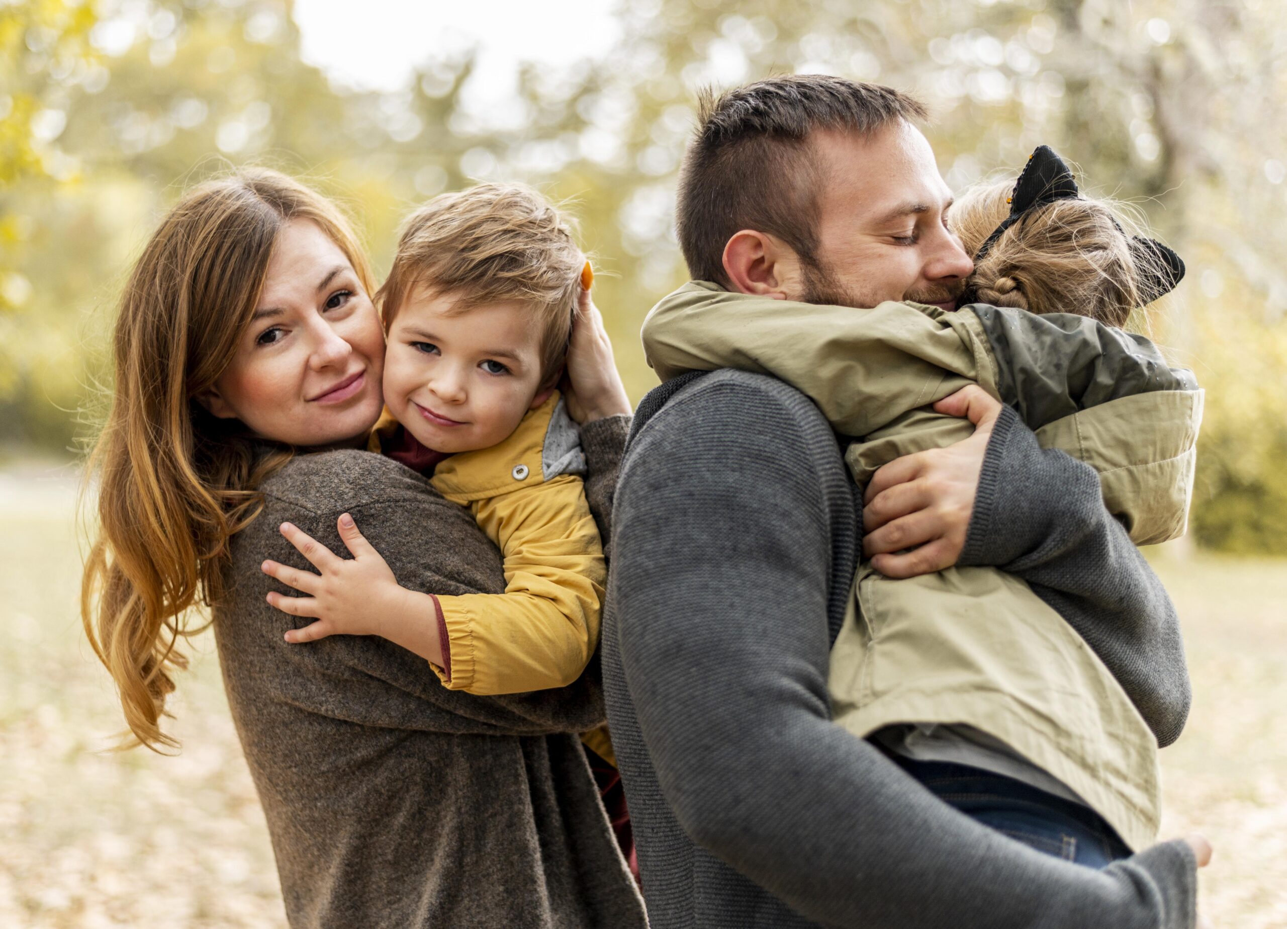 medium-shot-happy-parents-hugging-kids