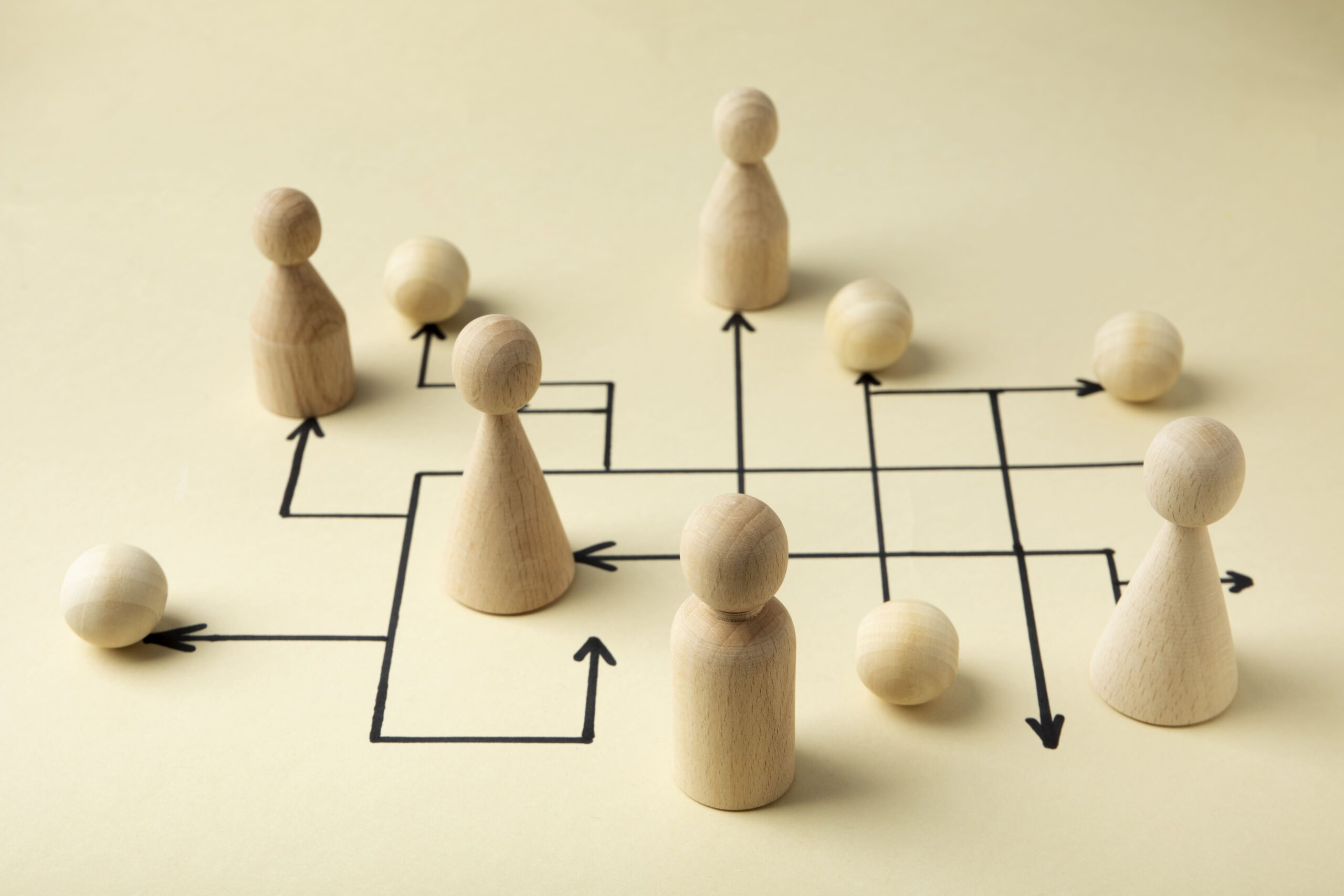 high-angle-wooden-pawns-arrangement (1)