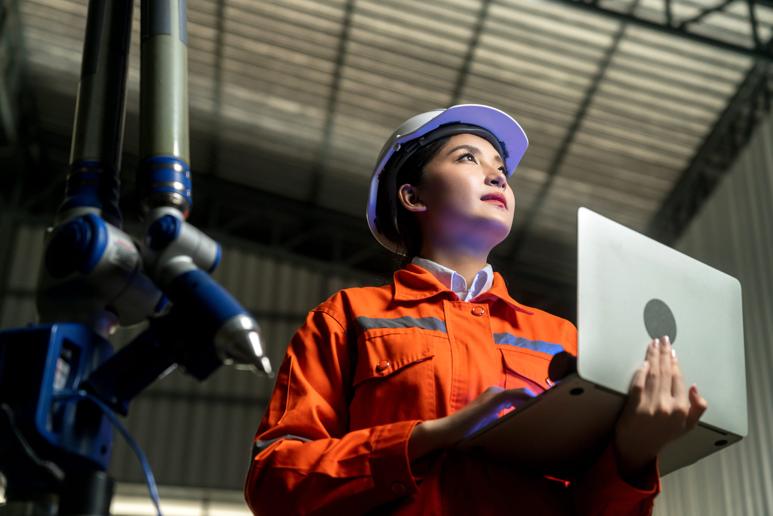engineer-specialist-asian-female-technician-maintenance-inspect-relay-robot-arm-system-with-laptop-control-quality-operate-process-work-heavy-industry-40-manufacturing-smart-factory (1)